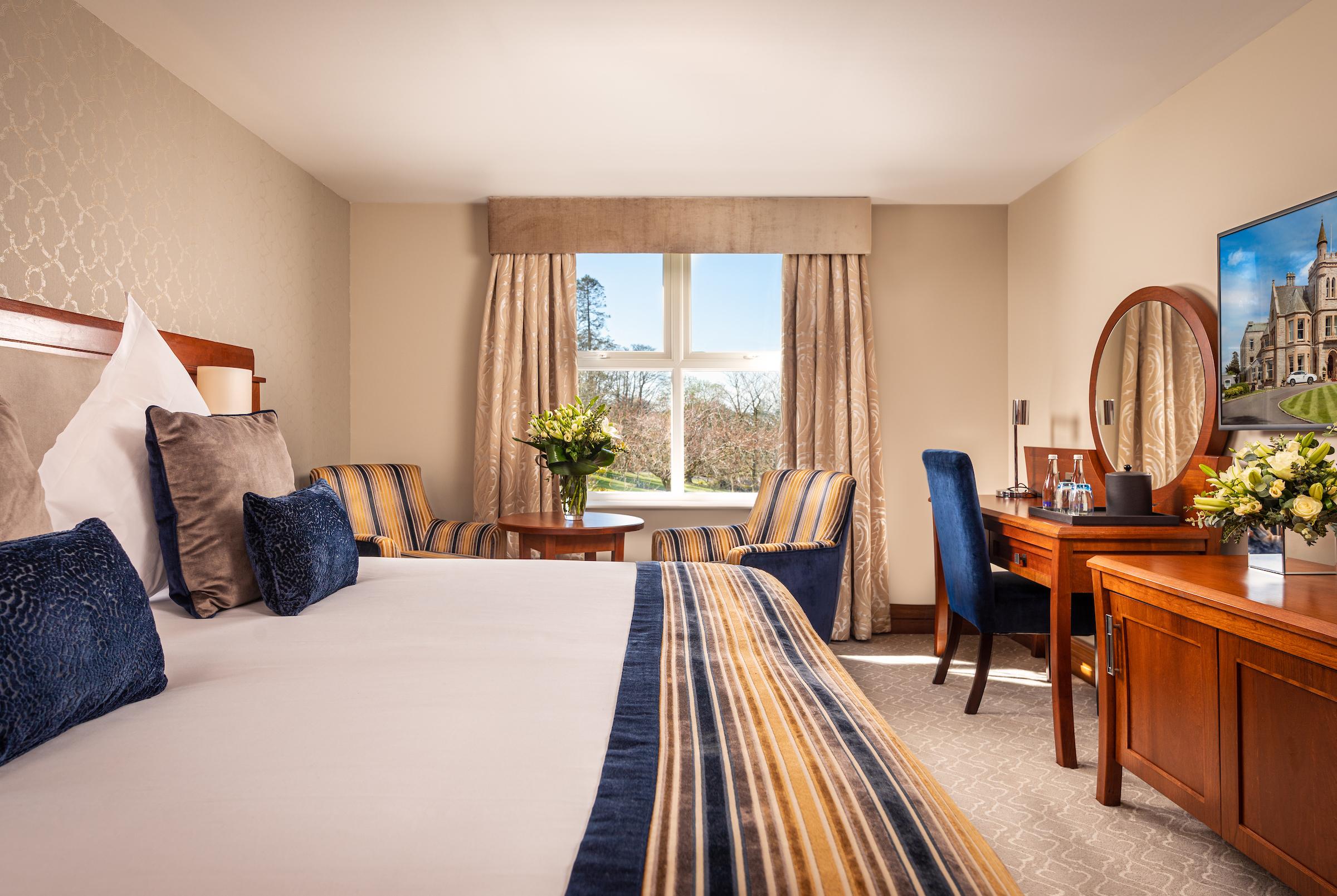 The Culloden Estate And Spa Холивуд Экстерьер фото A bedroom at the Killarney International Hotel