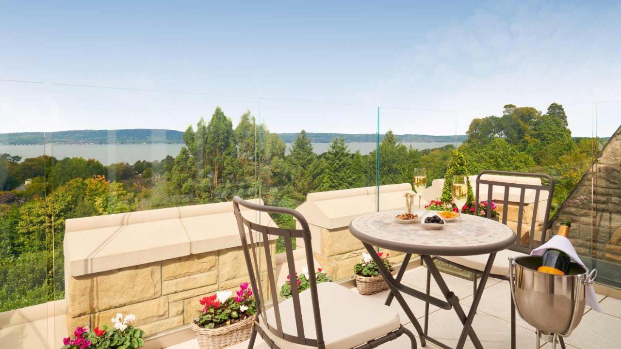 The Culloden Estate And Spa Холивуд Экстерьер фото A view of the lake from the balcony of a house in the village
